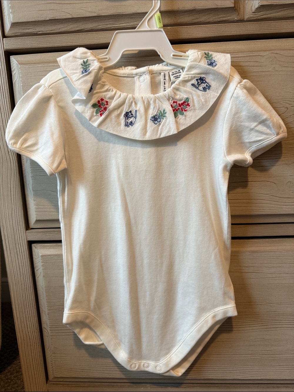 Janie and Jack White Ruffle Collar Bodysuit with Blue, Red and Green Embroidery